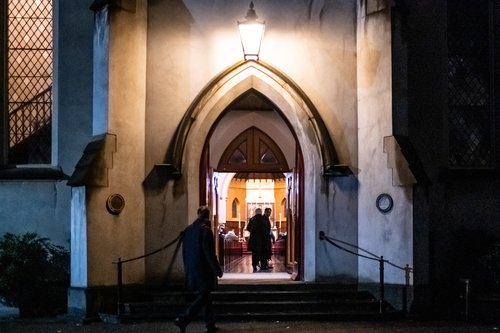 The front door of St Peter's Eastern Hill at nighttime
